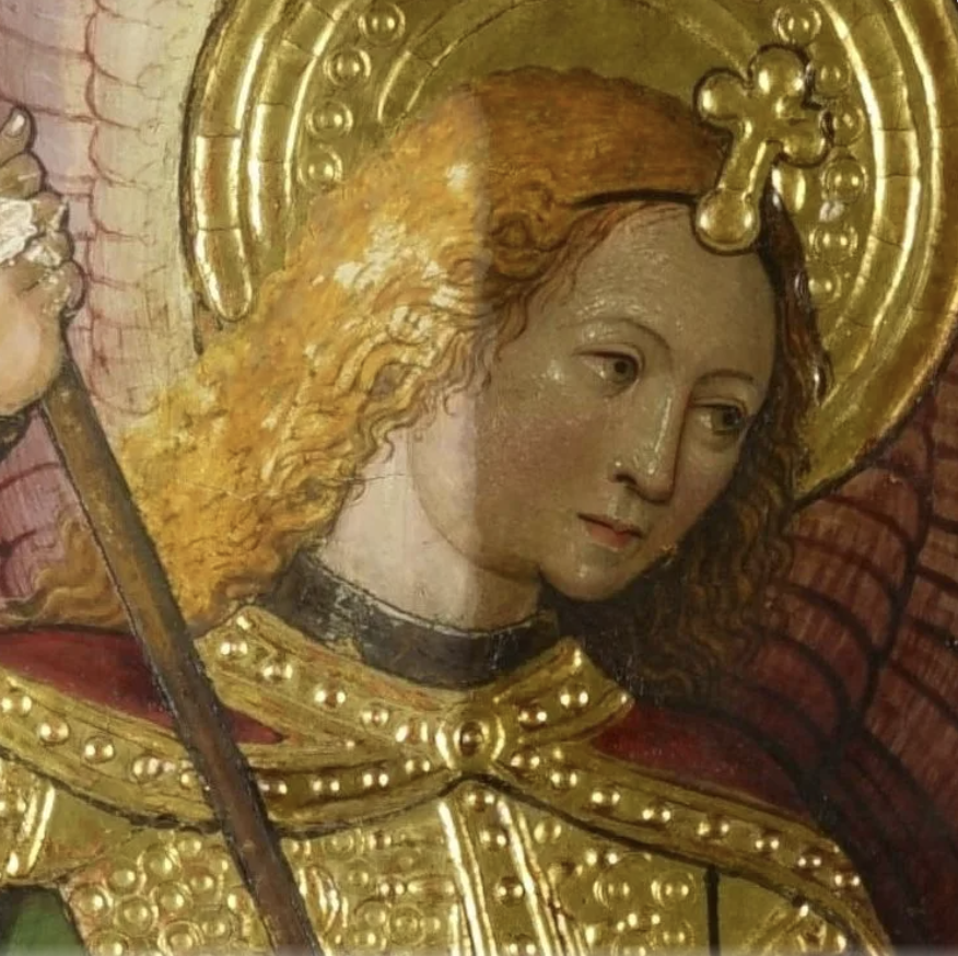 The face of a painted figure during the process of varnish removal